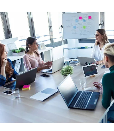 Team of professionals collaborating around a conference table representing LABUSA services