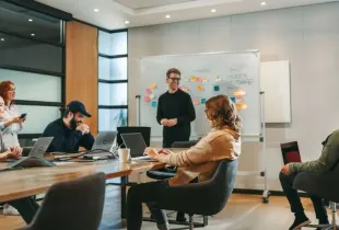 Group planning website design with vision board